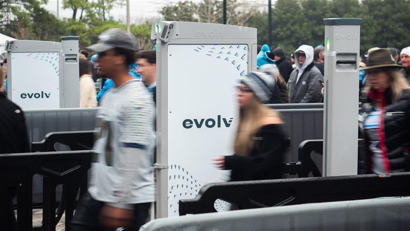 Fans passing through Evolv Express® Gen2 systems at the entrance to Bank of America Stadium