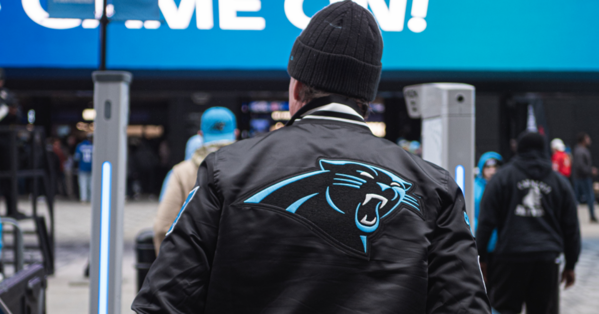 carolina panthers fan walking through evolv express gen2 at bank of america stadium